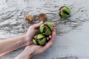 Split coconuts in hands